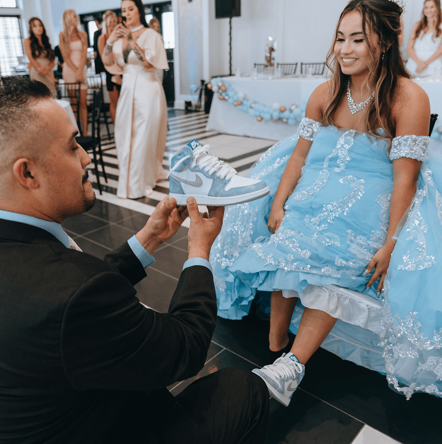 Father daughter changing of the shoes at Chicago quinceanera